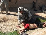 jeremy_morlock_pulling_dead_afghan_boy_by_his_hair_in_20101-300x225.jpg