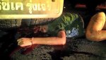Young woman caught under truck wheel 02.jpg