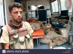 an-iraqi-soldier-guards-the-transfer-of-dead-iraqi-soldiers-to-a-morgue-FFY5RR.jpg