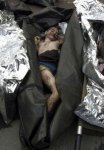 Relatives-Identify-Dead-Children-In-Vladikavkaz-Russia-Sept-2004-19.jpg